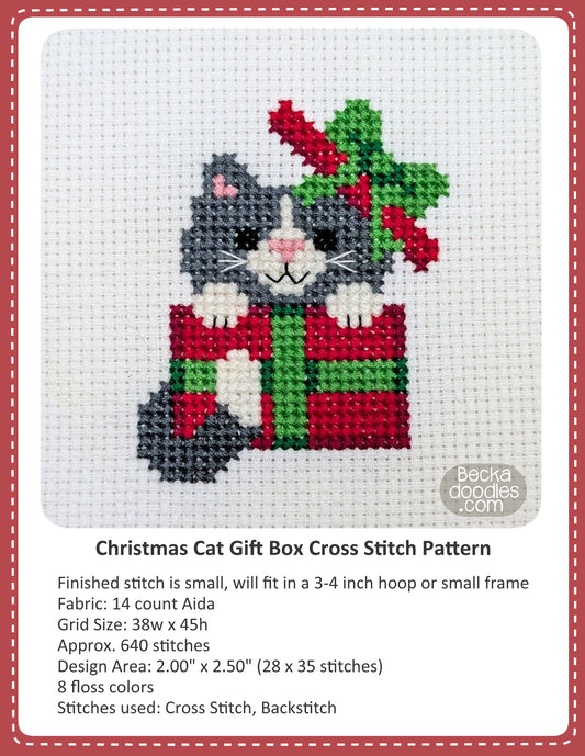 Graphic design layout of 'Christmas Cat Gift Box Cross Stitch Pattern' design by BeckaDoodles, showing a completed stitched cat inside a red and green Christmas gift on white fabric, with text detailing the pattern specifications below.