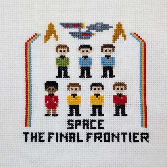 Cross-stitched design of Star Trek characters with a spaceship and 'Space: The Final Frontier' text on a white background.