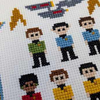 Cross-stitched pattern of characters from a science fiction series on a white background