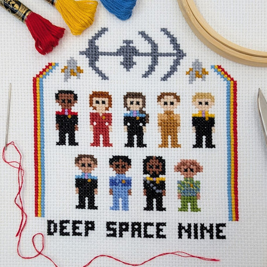Cross-stitch pattern of characters from science fiction series with 'Deep Space Nine' text on a white background.