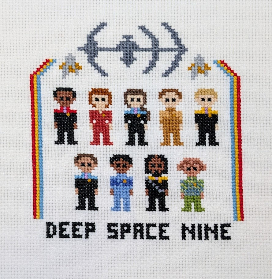Cross-stitched design of characters from science fiction with 'Deep Space Nine' text on a white background.